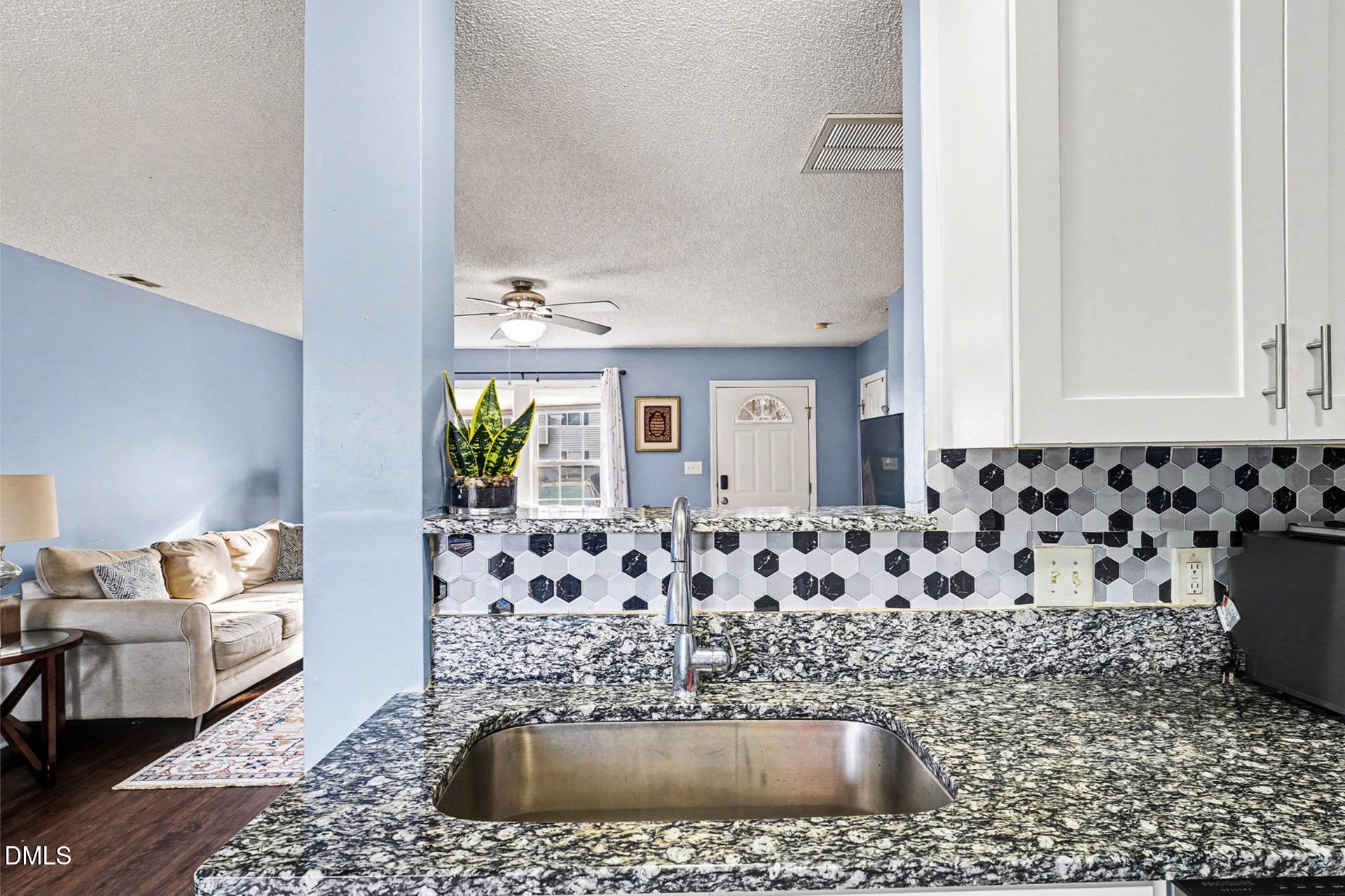 5103 Jimmy Ridge Place Raleigh, NC 27610 - Photo 15 of 29 a bathroom with a bathtub and shower
