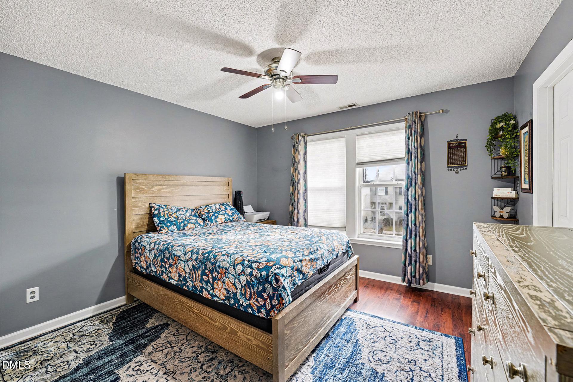 5103 Jimmy Ridge Place Raleigh, NC 27610 - Photo 17 of 29 a bedroom with a bed and window