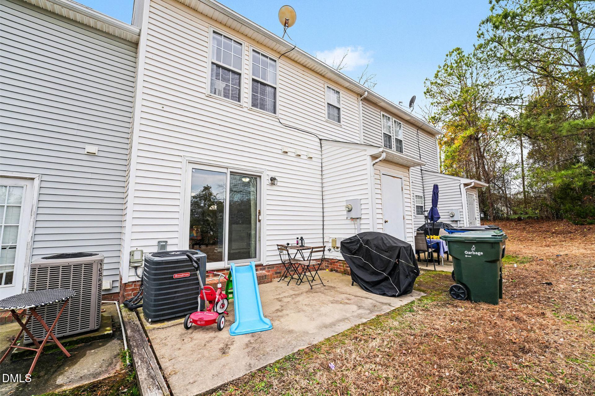 5103 Jimmy Ridge Place Raleigh, NC 27610 - Photo 29 of 29 a view of backyard with deck and outdoor seating