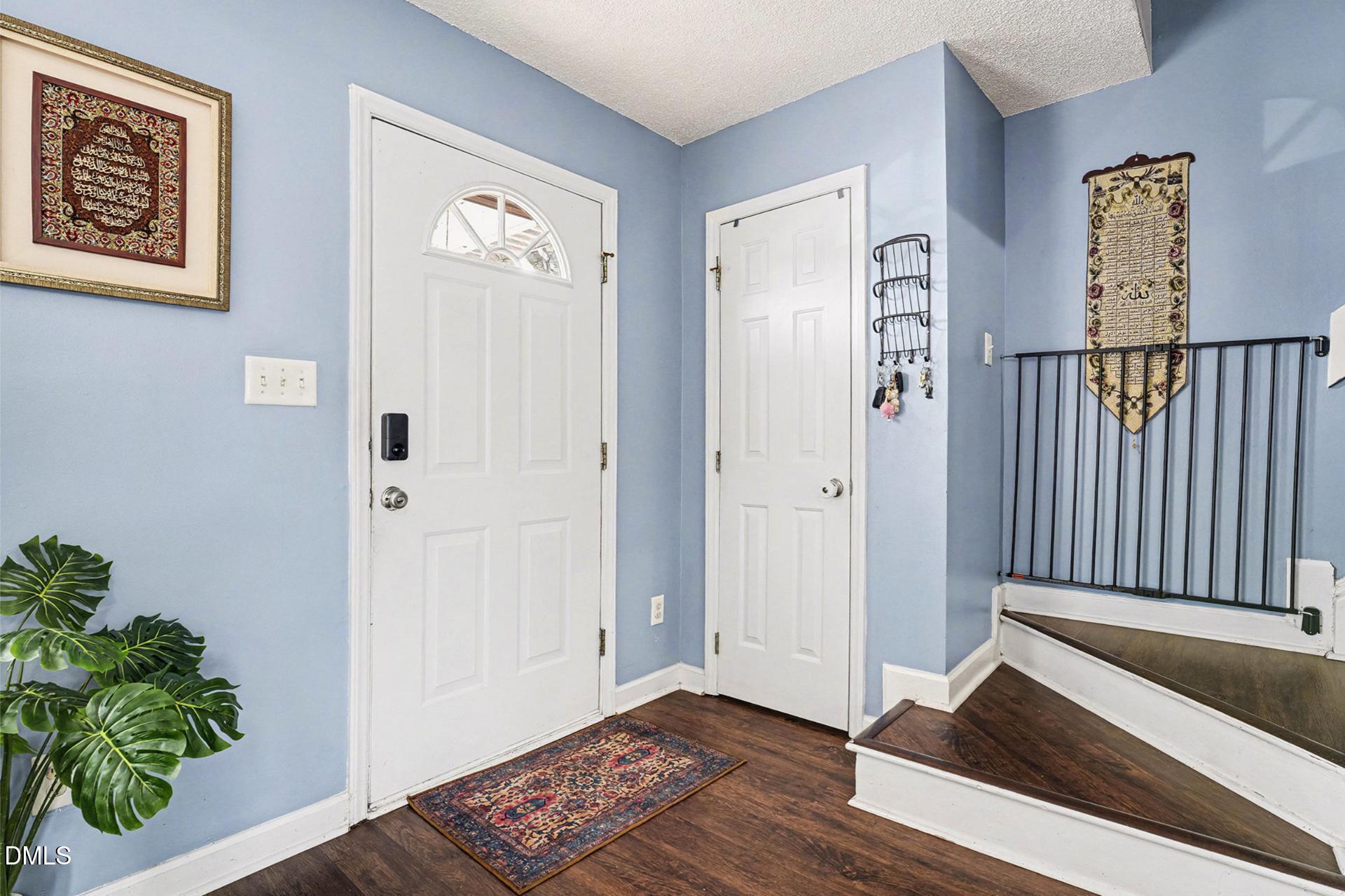 5103 Jimmy Ridge Place Raleigh, NC 27610 - Photo 4 of 29 a view of entryway with wooden floor