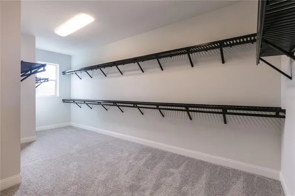a view of an empty walk in closet