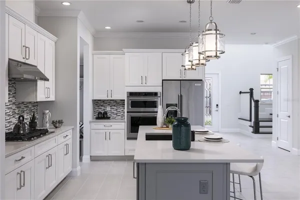 a kitchen with a sink and refrigerator