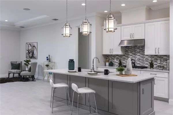 a kitchen with a sink stove and cabinets