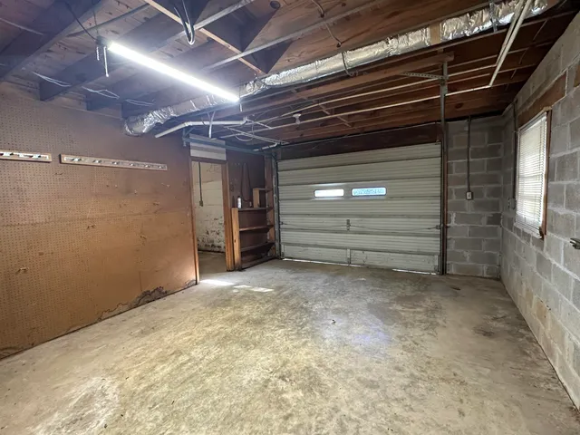a view of an empty room with a fireplace
