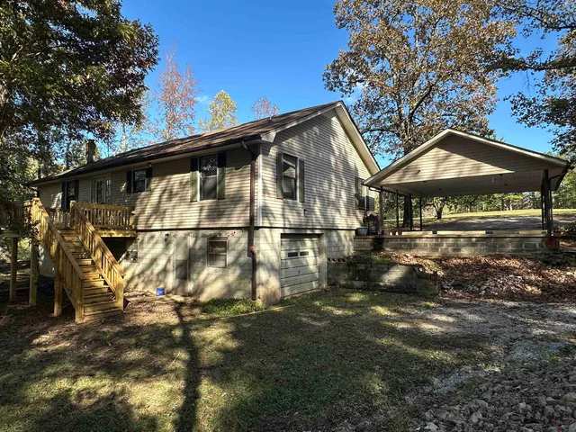 a view of a house with a tree