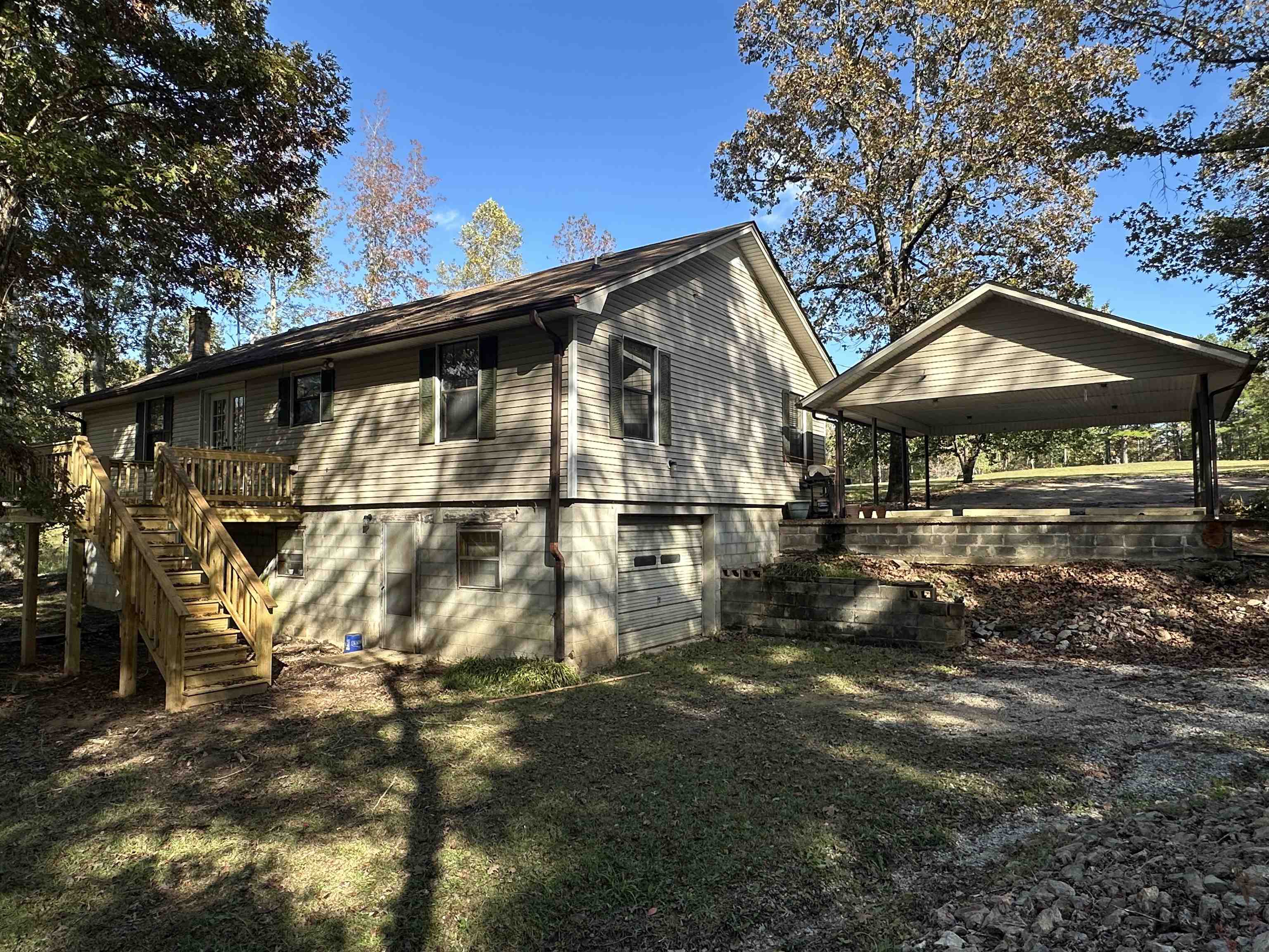 298 Matlock Road Ramer, TN 38367 - Photo 14 of 17 a view of a large house with a big yard and large trees