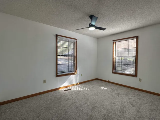 a bathroom with a double vanity sink a mirror and a bathtub