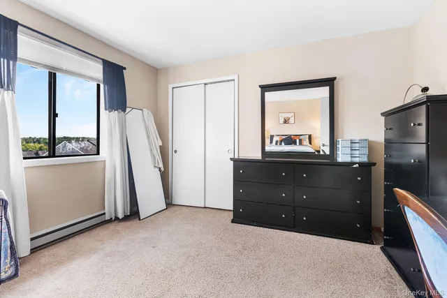 a room with a mirror vanity and a sink
