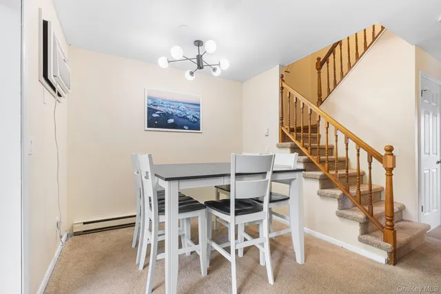a view of staircase with wooden floor and fan