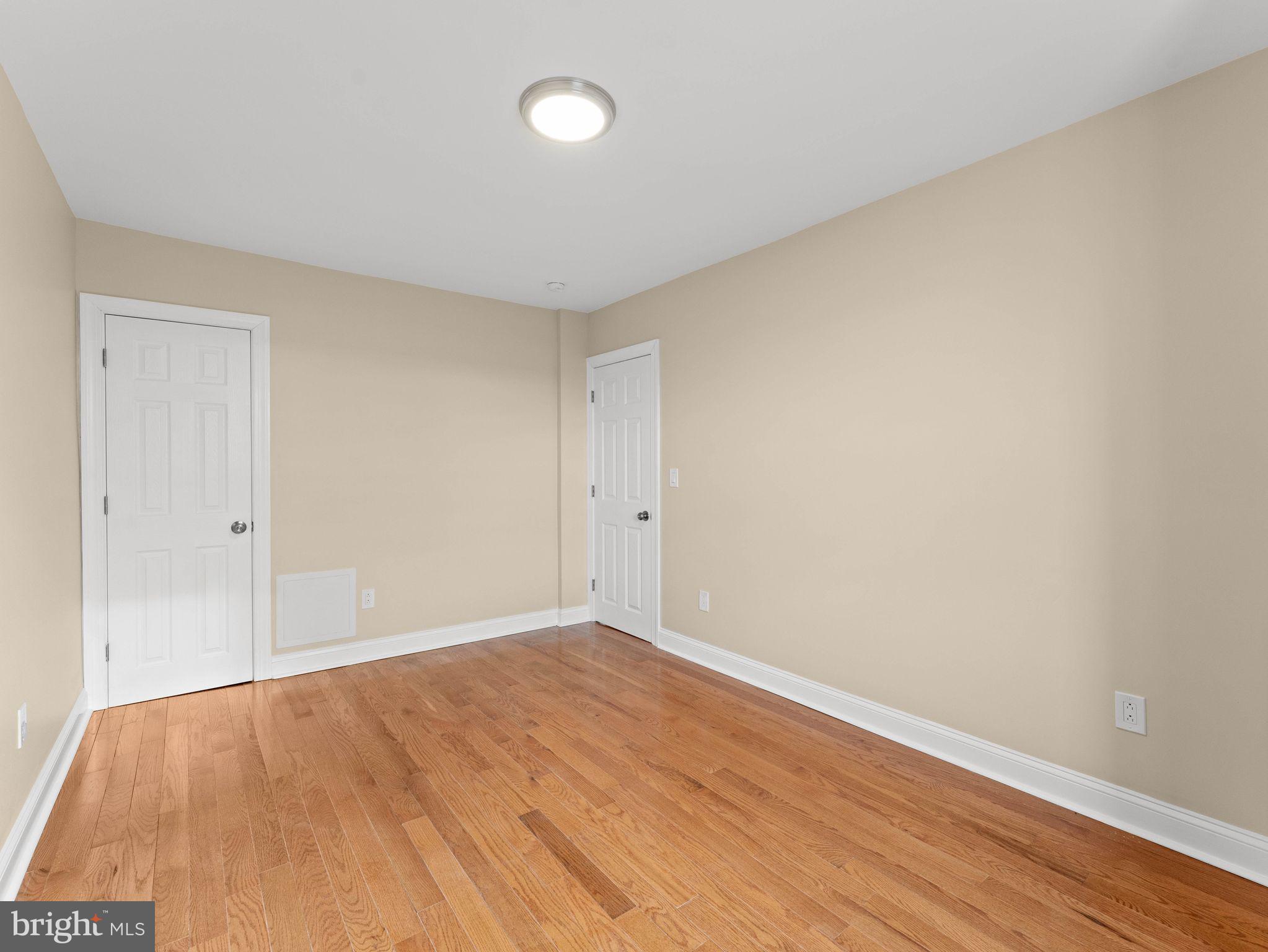7510 Rugby Street Philadelphia, PA 19150 - Photo 13 of 22 a view of an empty room with wooden floor