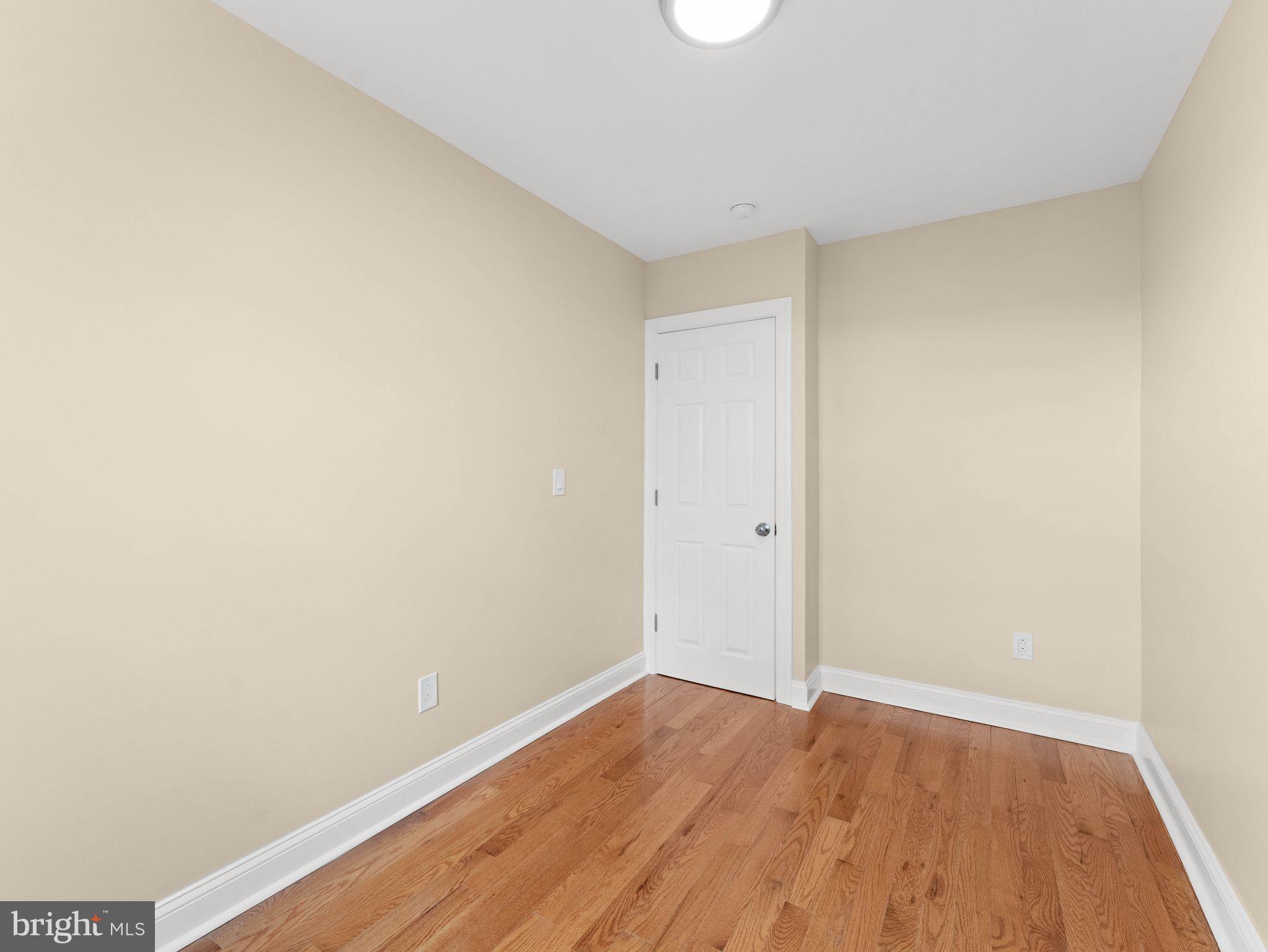 7510 Rugby Street Philadelphia, PA 19150 - Photo 15 of 22 a view of an empty room with wooden floor