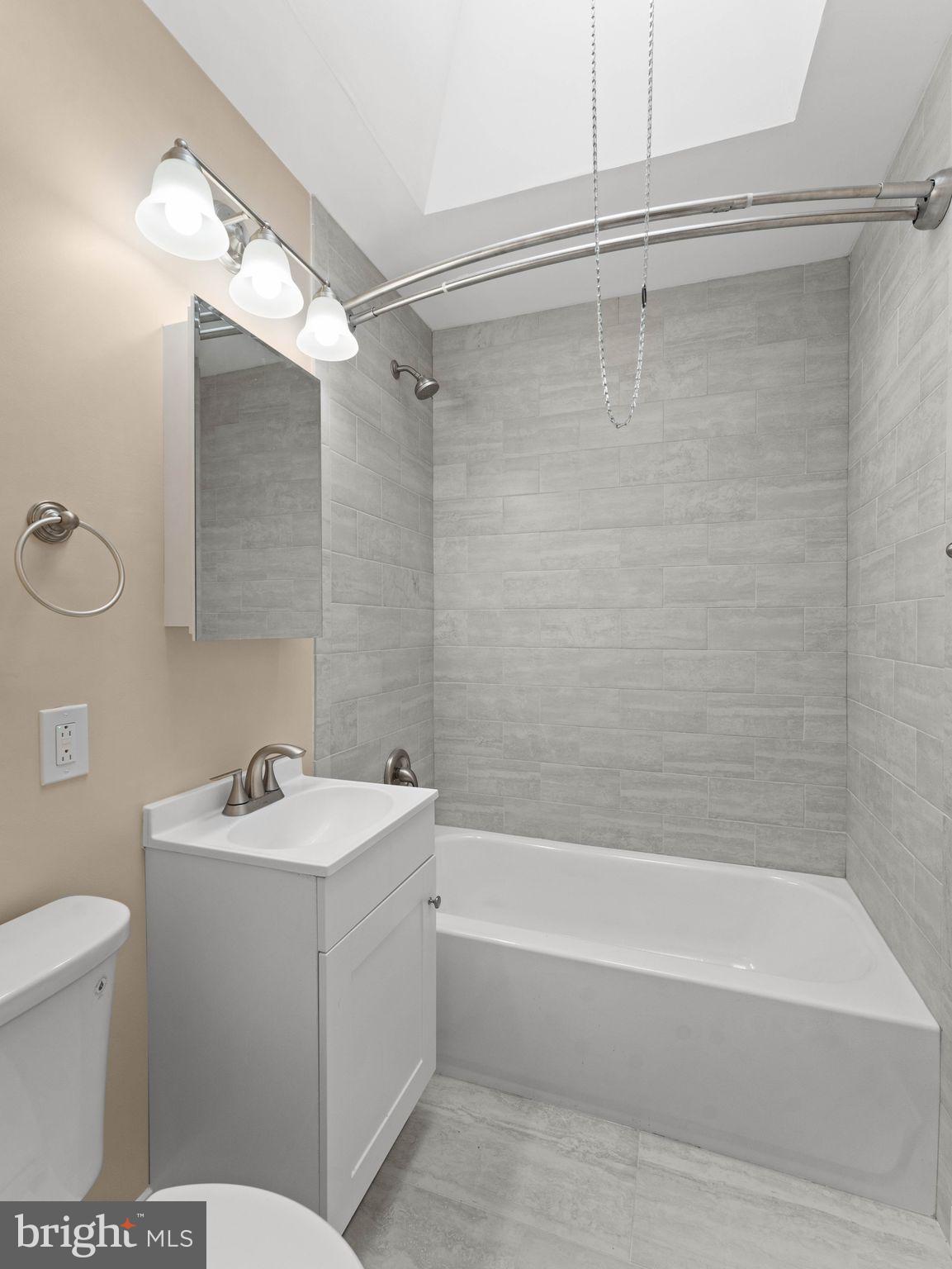 7510 Rugby Street Philadelphia, PA 19150 - Photo 17 of 22 a bathroom with a sink toilet and shower