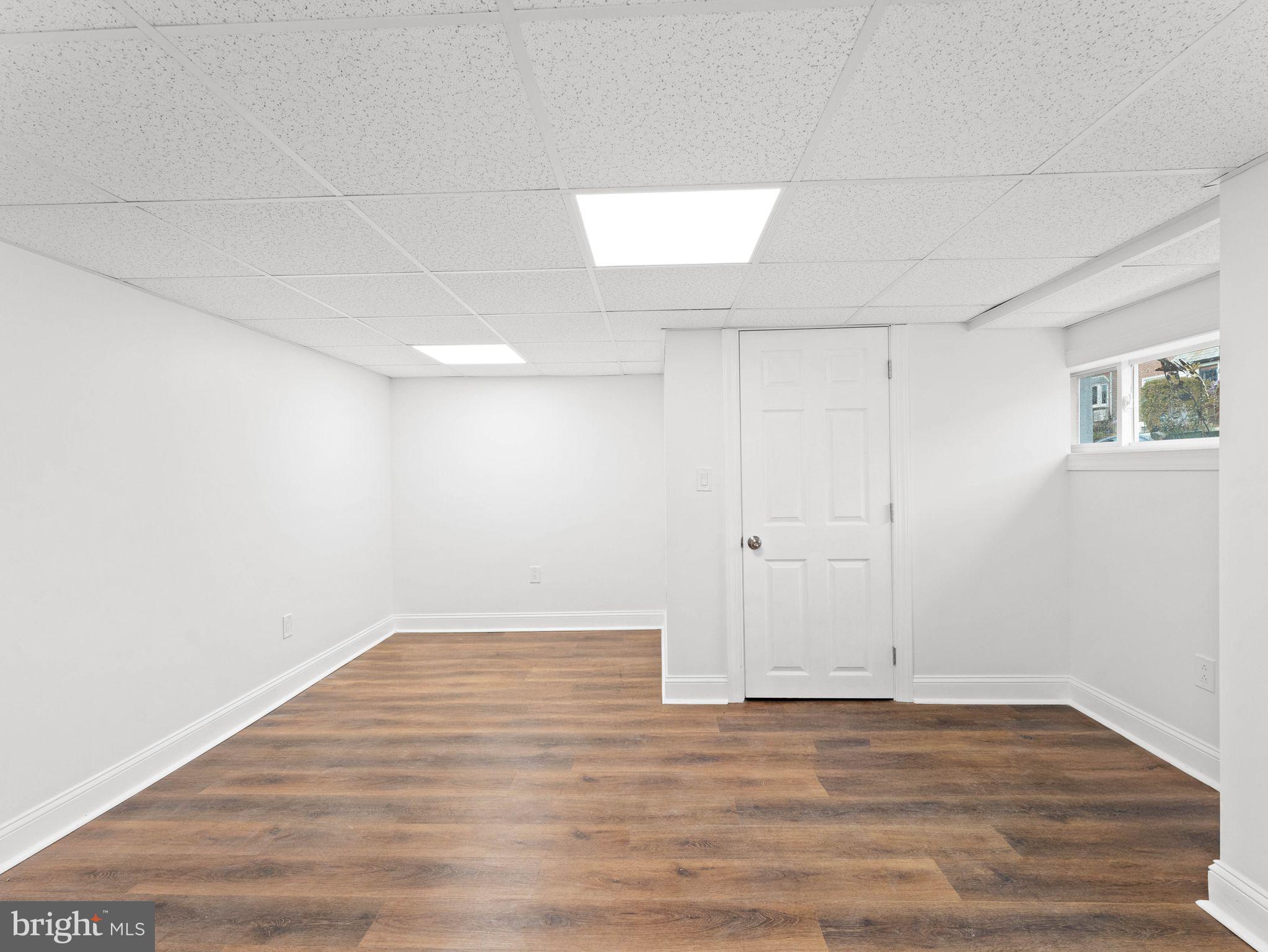 7510 Rugby Street Philadelphia, PA 19150 - Photo 18 of 22 a view of an empty room with wooden floor