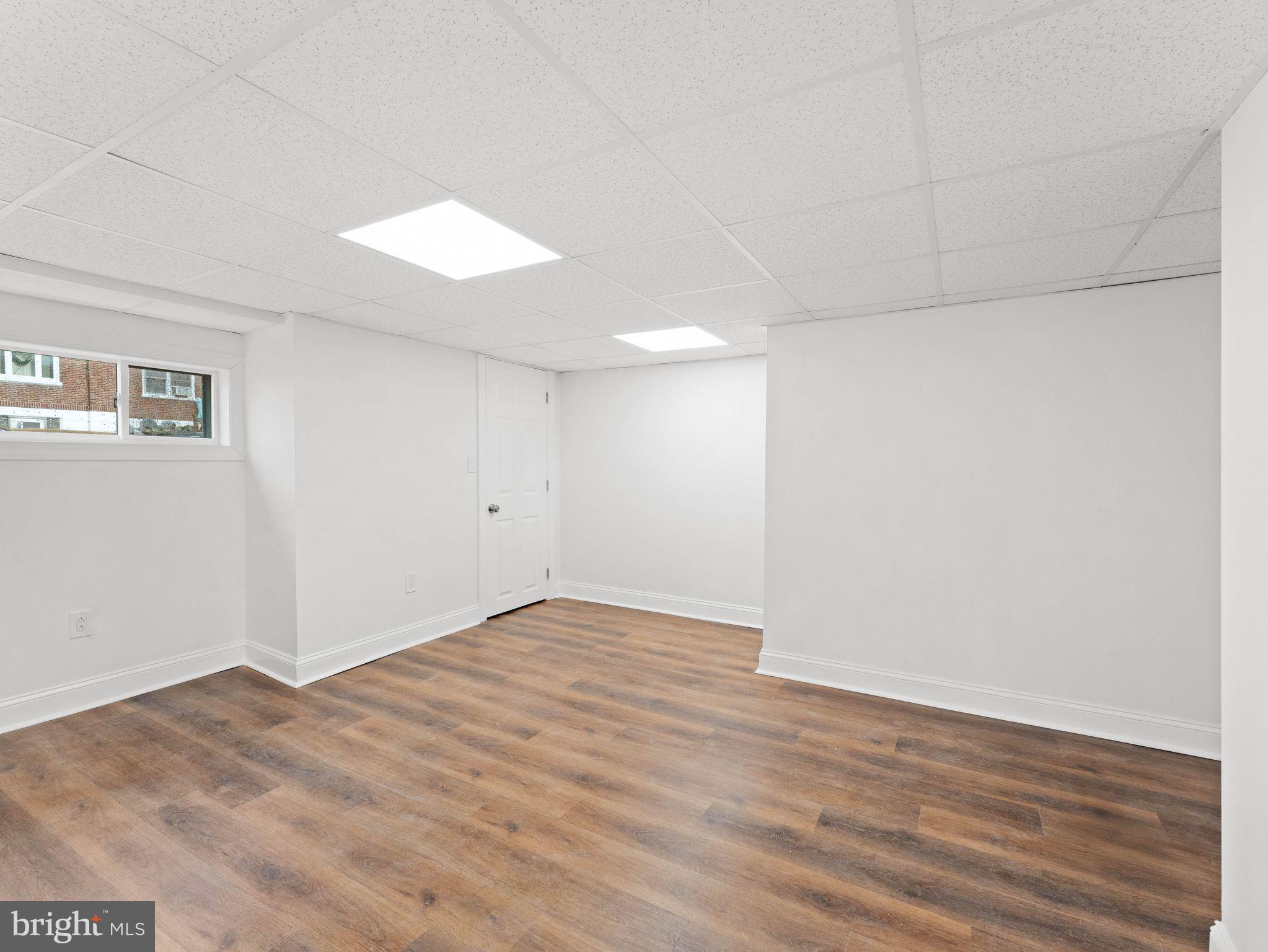 7510 Rugby Street Philadelphia, PA 19150 - Photo 19 of 22 a view of an empty room with wooden floor