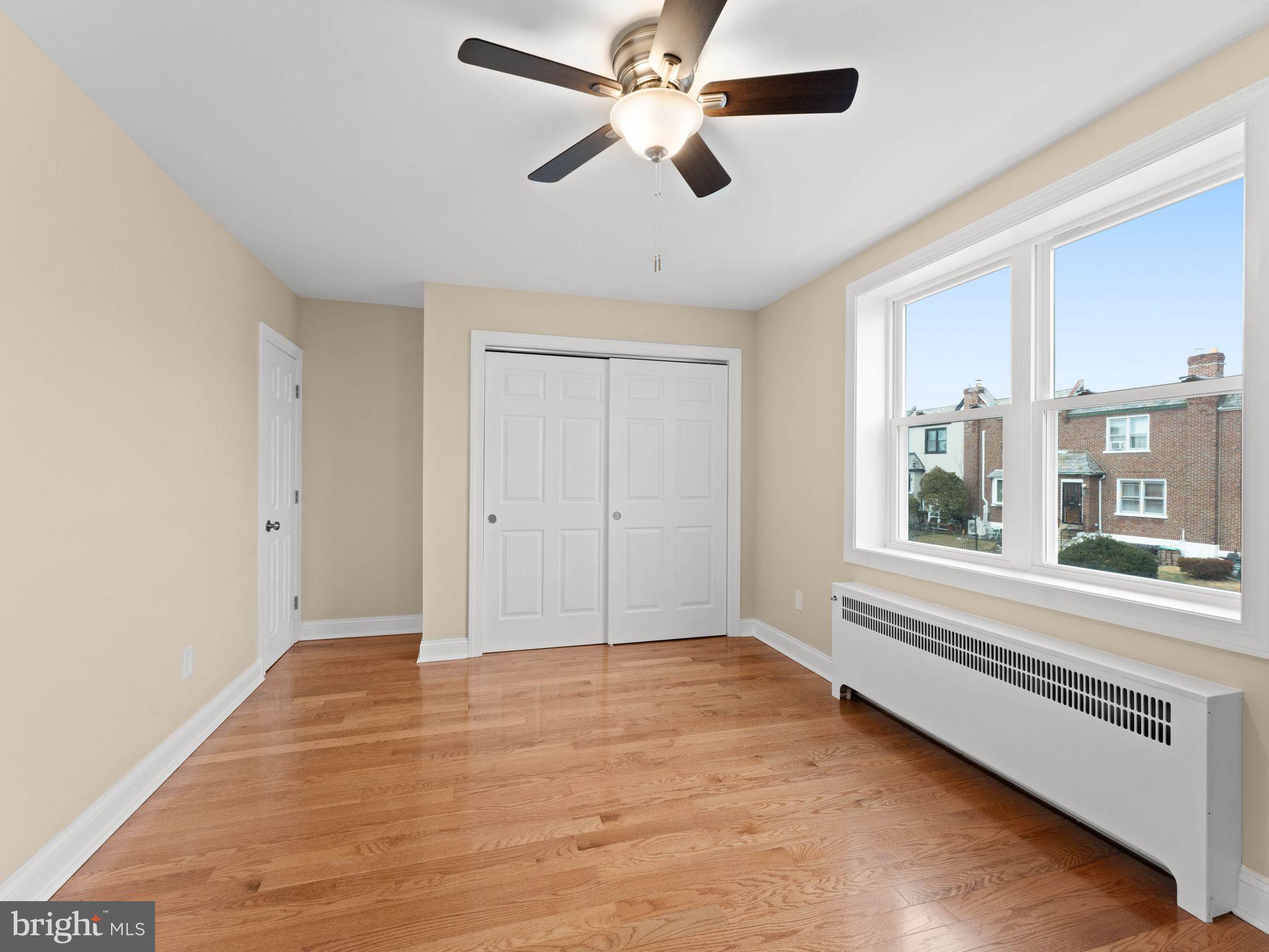 7510 Rugby Street Philadelphia, PA 19150 - Photo 9 of 22 a view of an empty room with a window and a ceiling fan