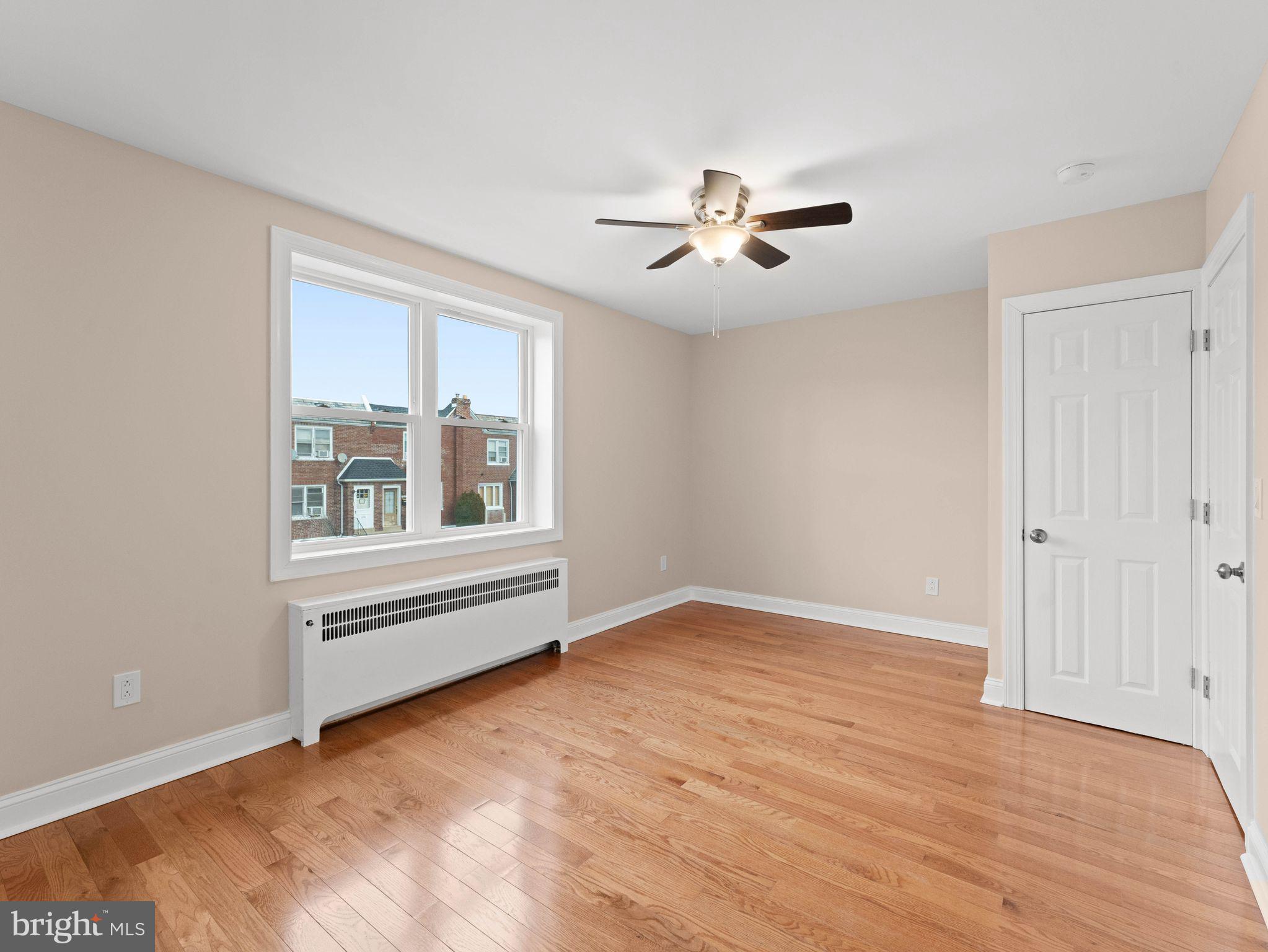7510 Rugby Street Philadelphia, PA 19150 - Photo 10 of 22 a view of empty room with wooden floor and fan