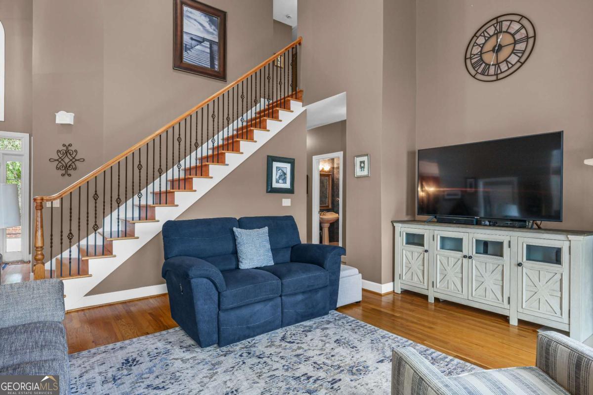 1283 Heritage Drive Villa Rica, GA 30180 - Photo 14 of 75 a living room with furniture and a flat screen tv