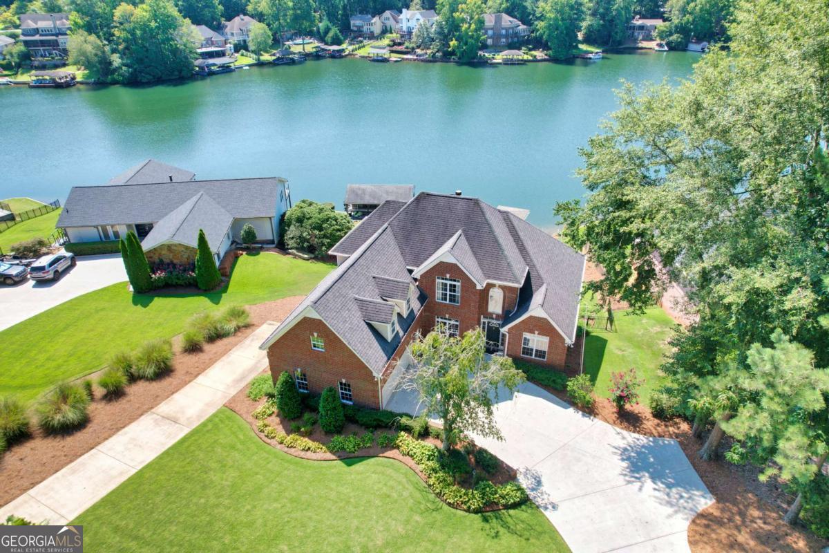 1283 Heritage Drive Villa Rica, GA 30180 - Photo 2 of 75 an aerial view of a house with a garden and lake view