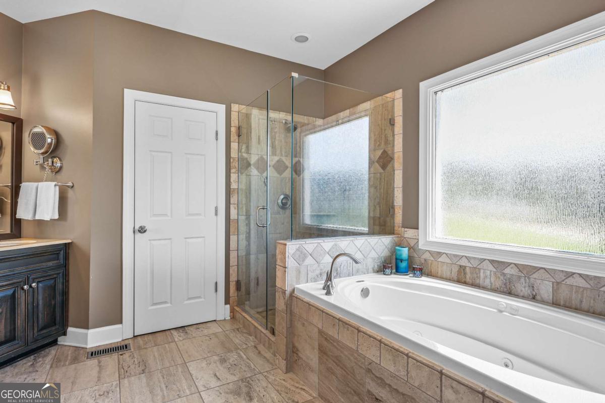 1283 Heritage Drive Villa Rica, GA 30180 - Photo 26 of 75 a bathroom with a bathtub and a sink
