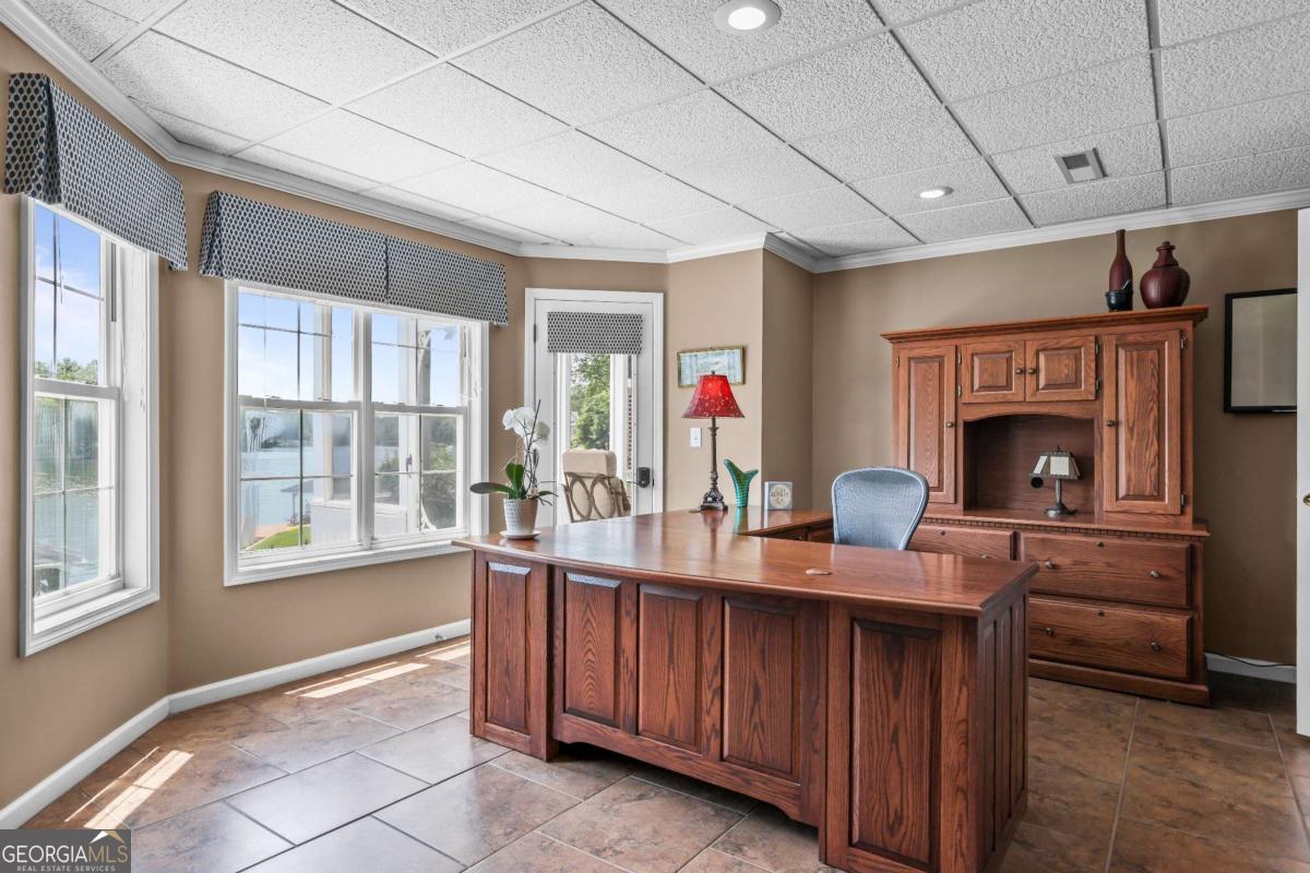1283 Heritage Drive Villa Rica, GA 30180 - Photo 40 of 75 a living room with furniture a fireplace and a window