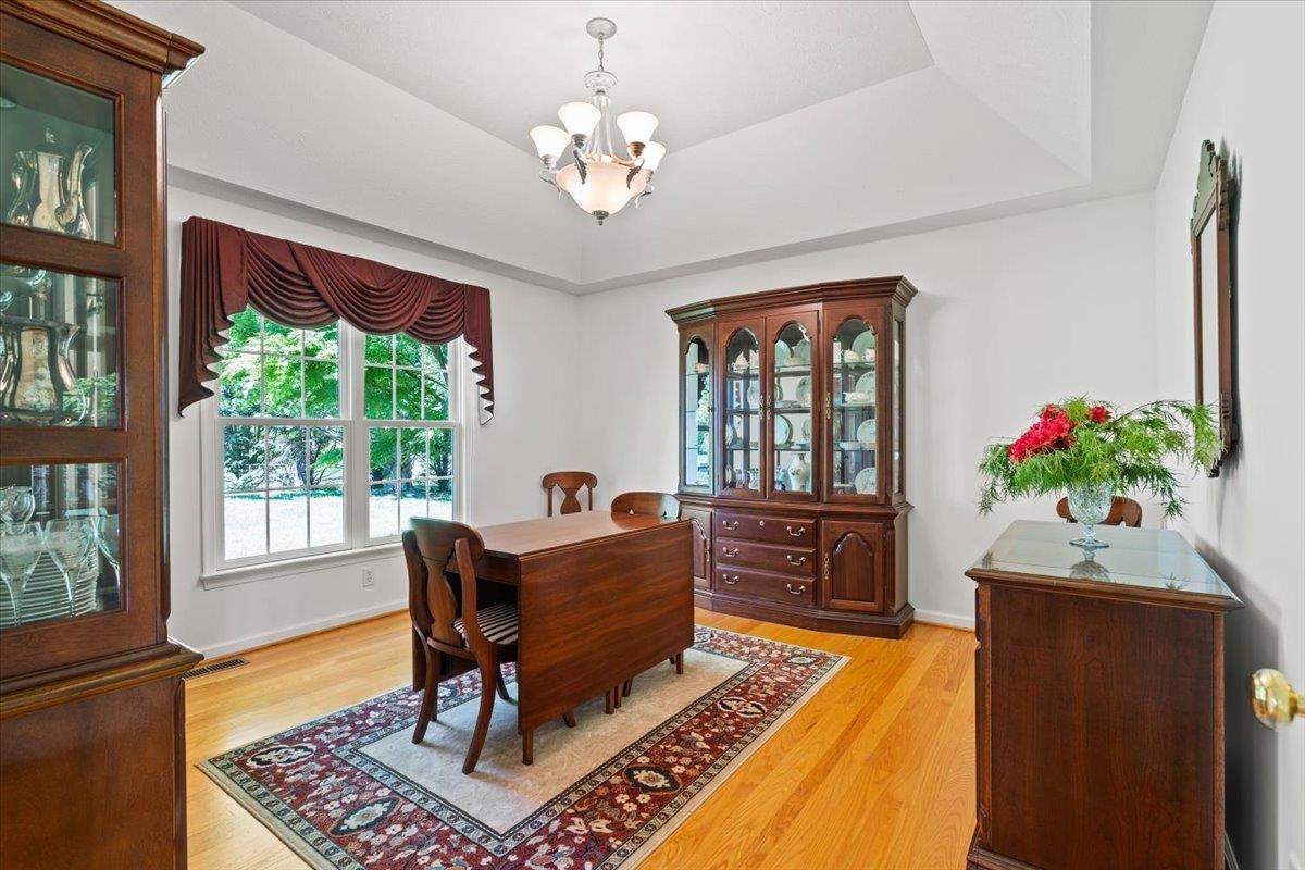 3740 Davis Road Penn Laird, VA 22846 - Photo 15 of 34 a living room with furniture and a chandelier