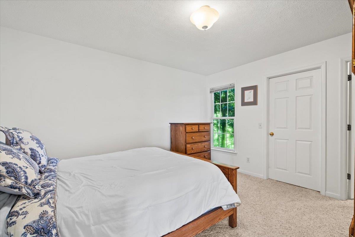 3740 Davis Road Penn Laird, VA 22846 - Photo 21 of 34 a bedroom with a bed and a cabinets