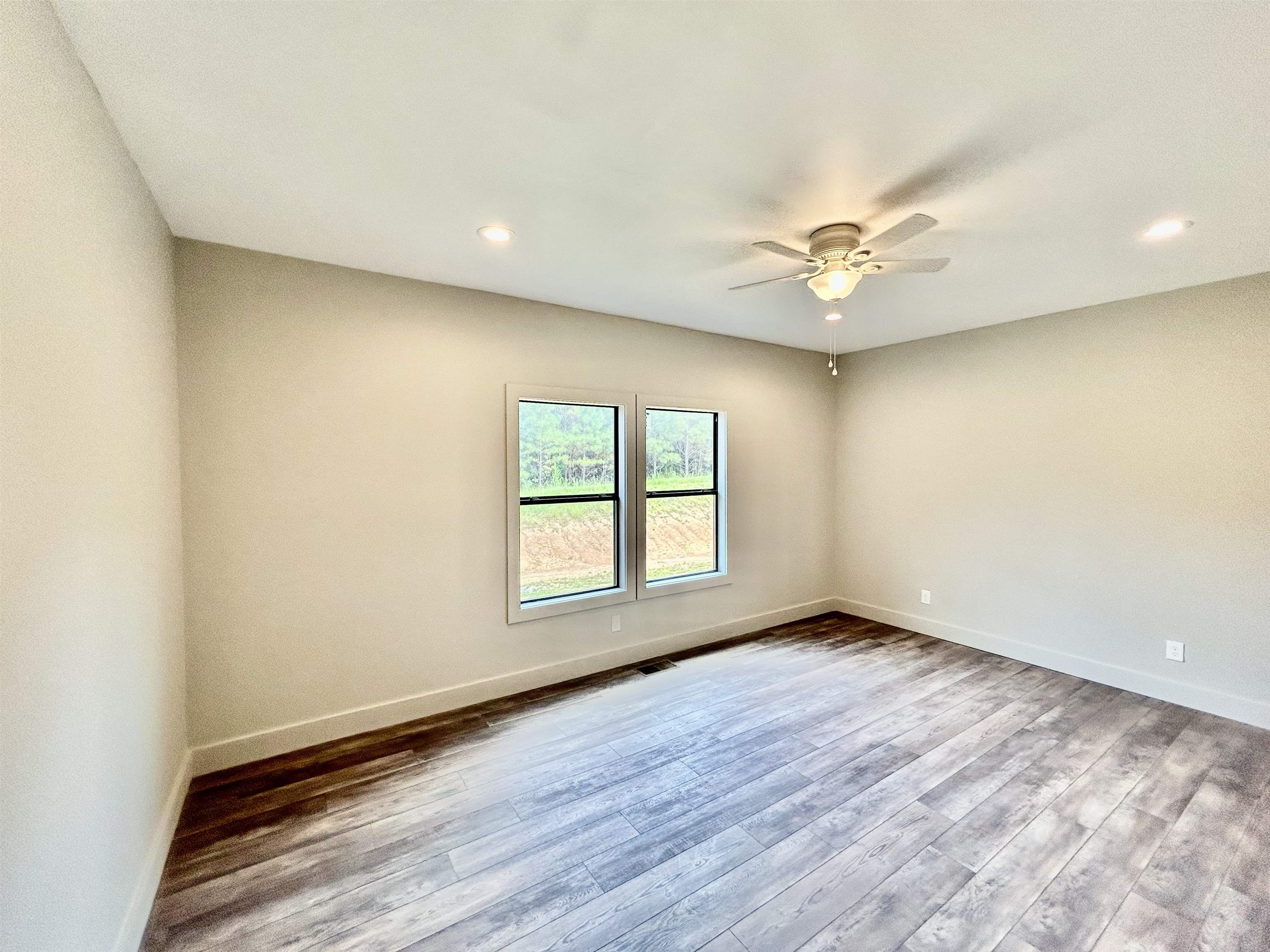 1318 Snowdown Road Iuka, MS 38852 - Photo 7 of 34 wooden floor in an empty room with a window