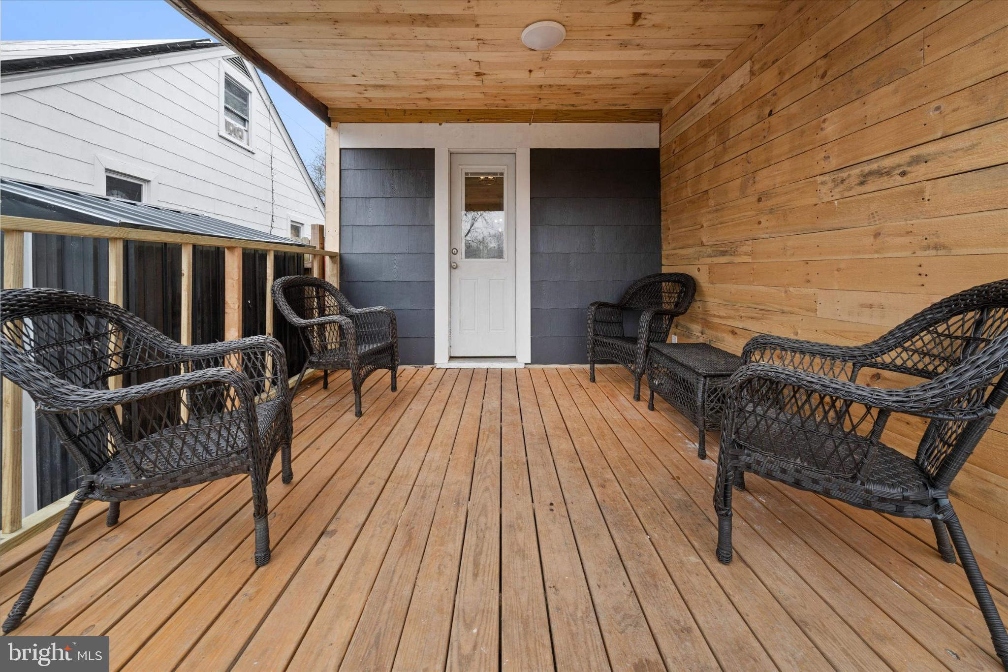 7 2nd Avenue New Castle, DE 19720 - Photo 9 of 44 Inviting porch with rustic wooden charm.