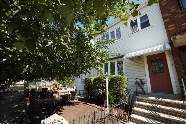 a view of backyard with patio and outdoor seating