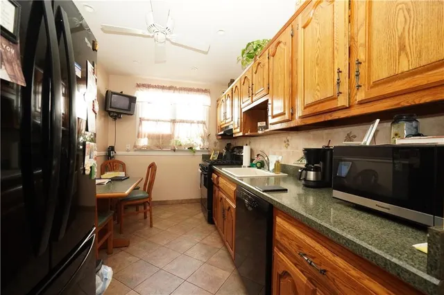 a kitchen with stainless steel appliances granite countertop a sink and cabinets