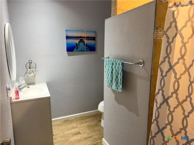 a bathroom with a sink and mirror
