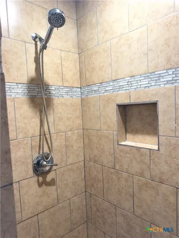 a bathroom with a sink and vanity