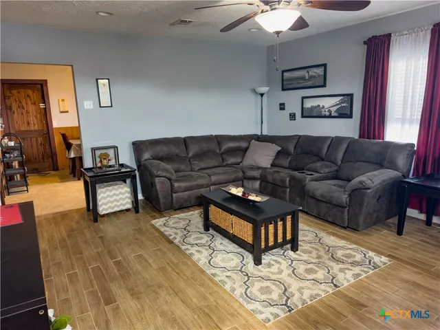 a living room with furniture and a rug