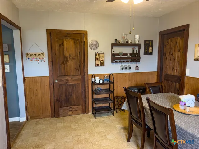 a view of kitchen with furniture and wooden floor