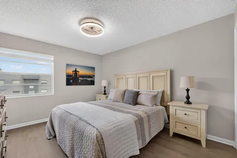 a bedroom with bed and window