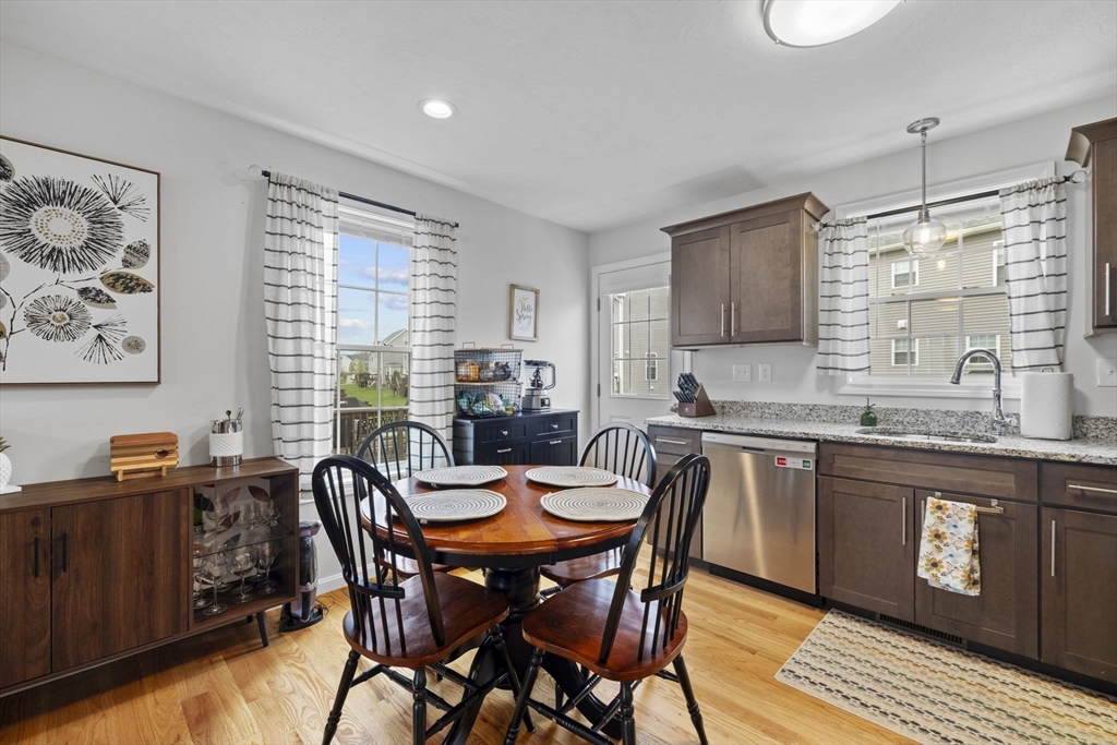 74 Riley Road, Unit 88 Tyngsboro, MA 01879 - Photo 8 of 31 a view of a dining room with furniture