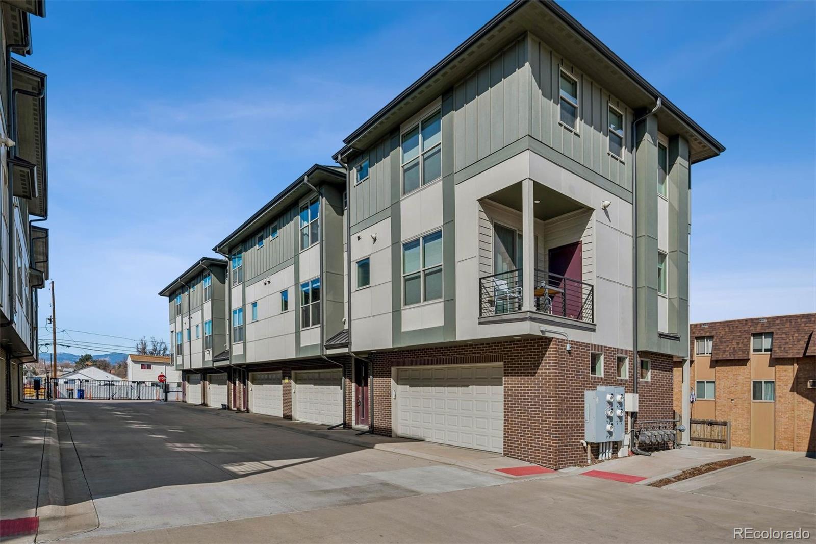 5366 Allison Street, Unit D Arvada, CO 80002 - Photo 11 of 28 a front view of a house with a street