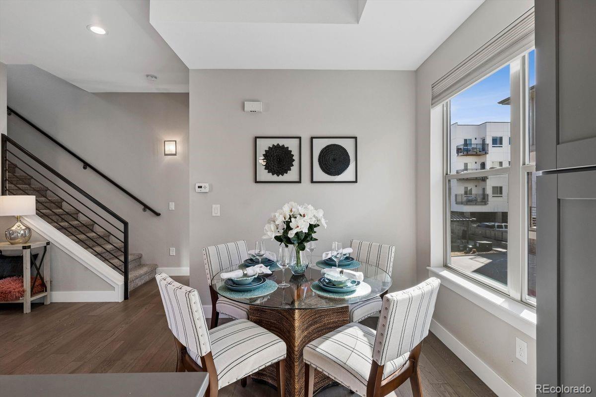 5366 Allison Street, Unit D Arvada, CO 80002 - Photo 19 of 28 a dining room with furniture and window