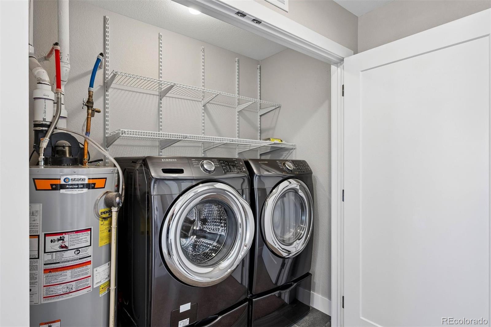 5366 Allison Street, Unit D Arvada, CO 80002 - Photo 23 of 28 a utility room with dryer and washer