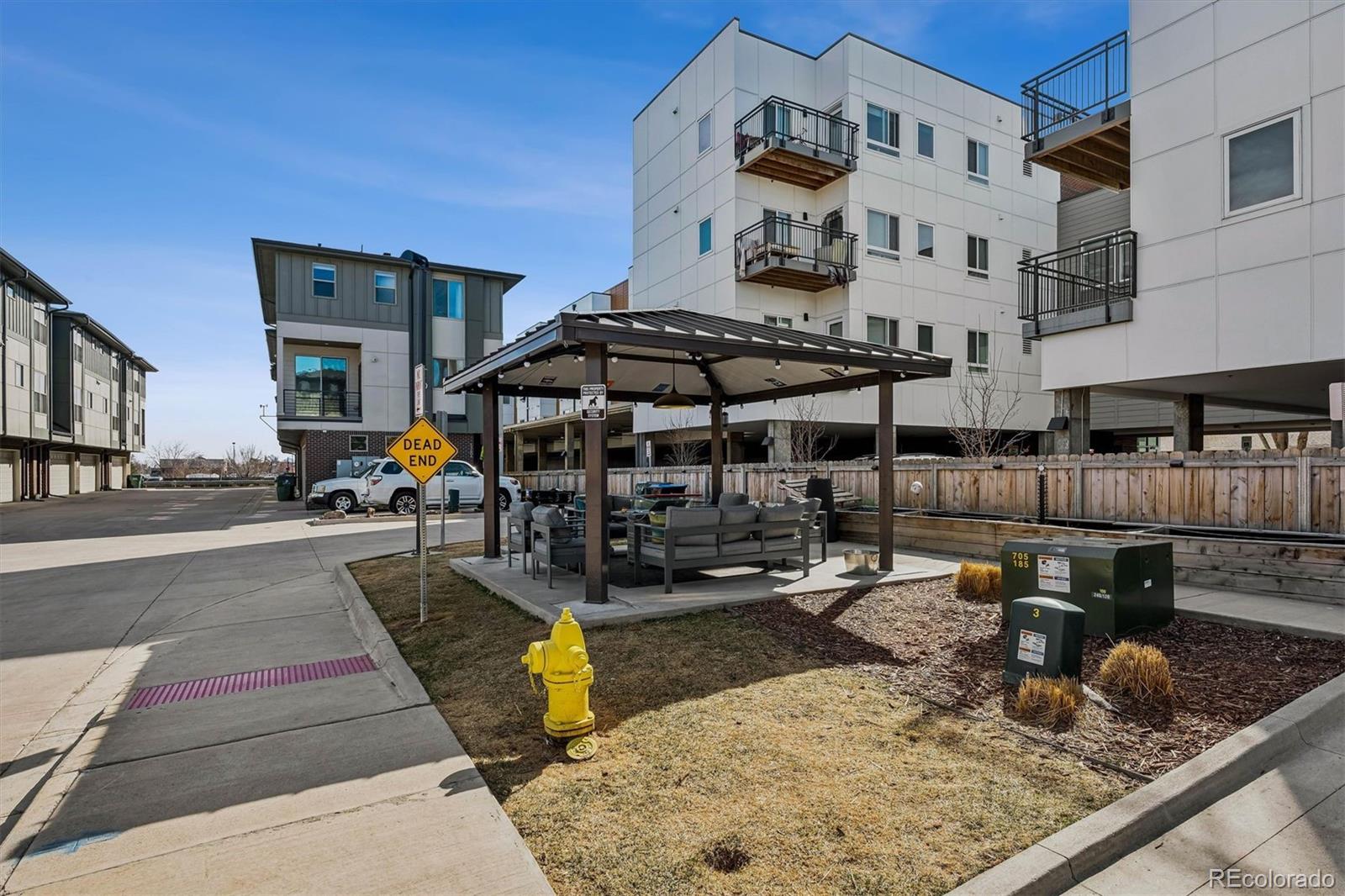 5366 Allison Street, Unit D Arvada, CO 80002 - Photo 27 of 28 a view of a building with sitting area