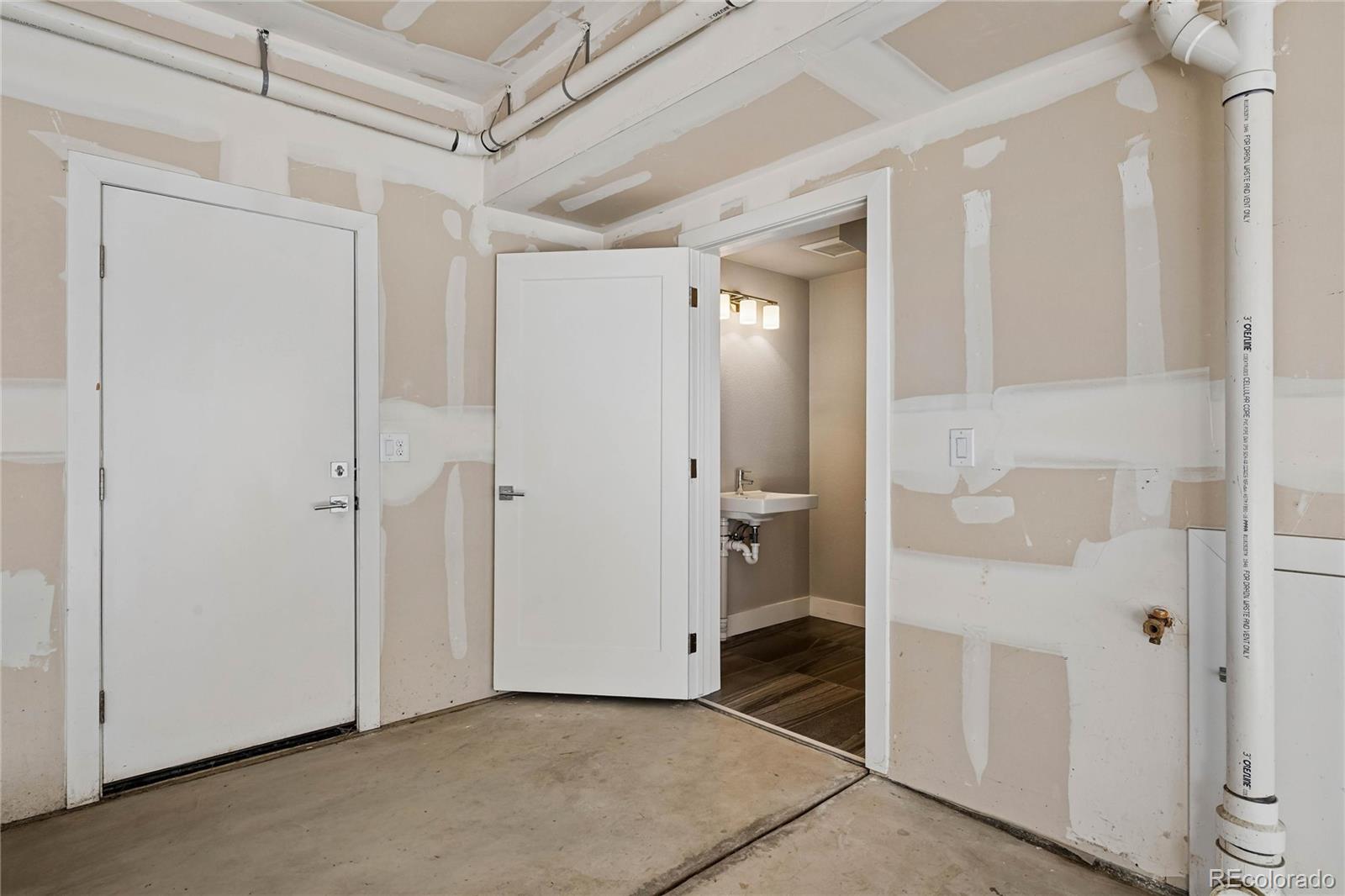 5366 Allison Street, Unit D Arvada, CO 80002 - Photo 9 of 28 a view of a bathroom with a glass door shower and a sink