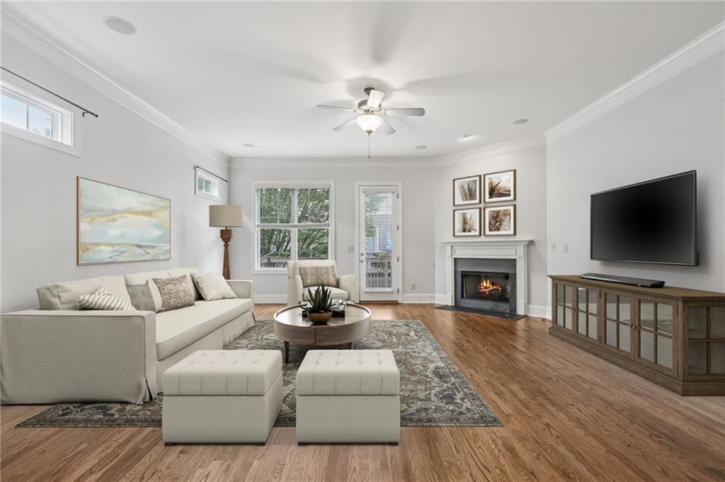 3107 Turman Circle Decatur, GA 30033 - Photo 1 of 1 a living room with furniture a flat screen tv and a fireplace