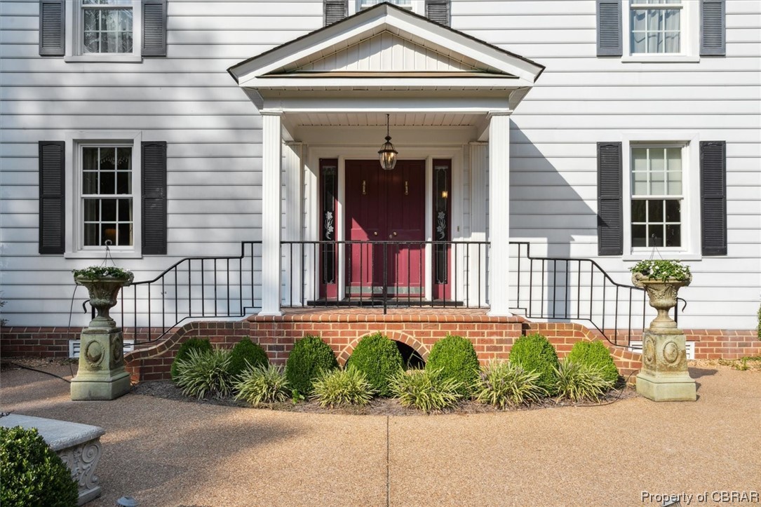 7175 Ware House Road Gloucester, VA 23061 - Photo 4 of 39 Doorway to property featuring a porch
