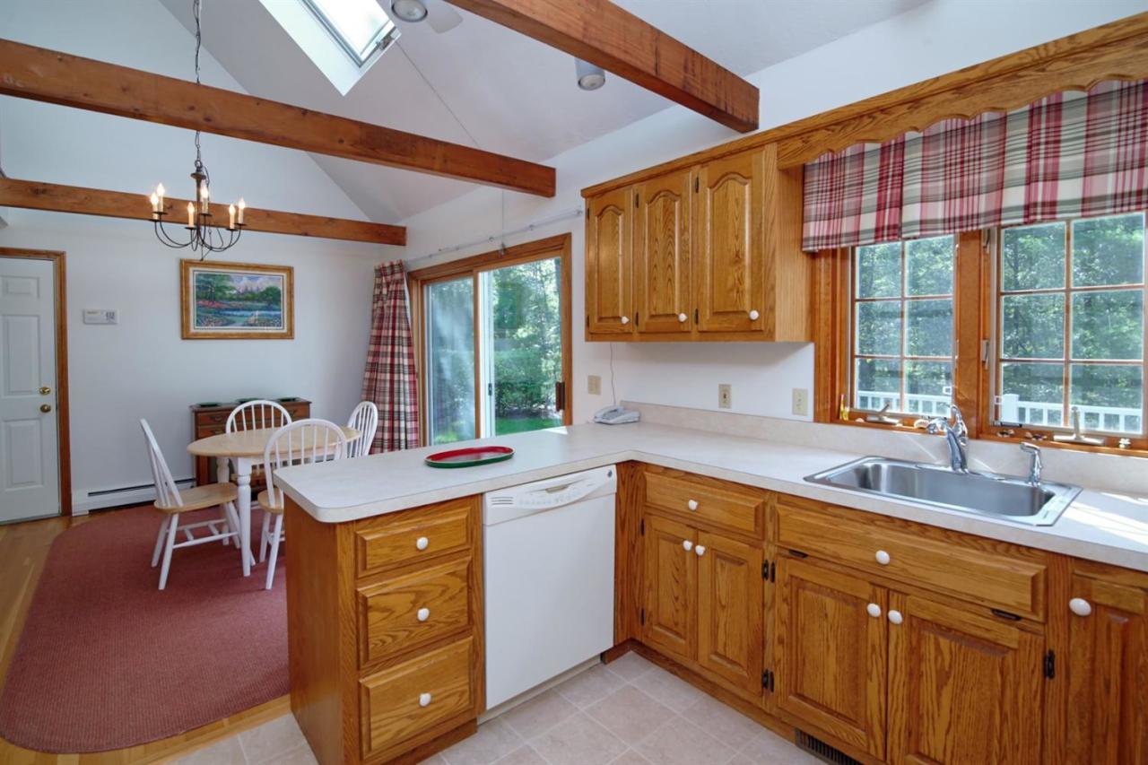 43 Piney Road Cotuit, MA 02635 - Photo 12 of 31 a kitchen with a sink cabinets and window