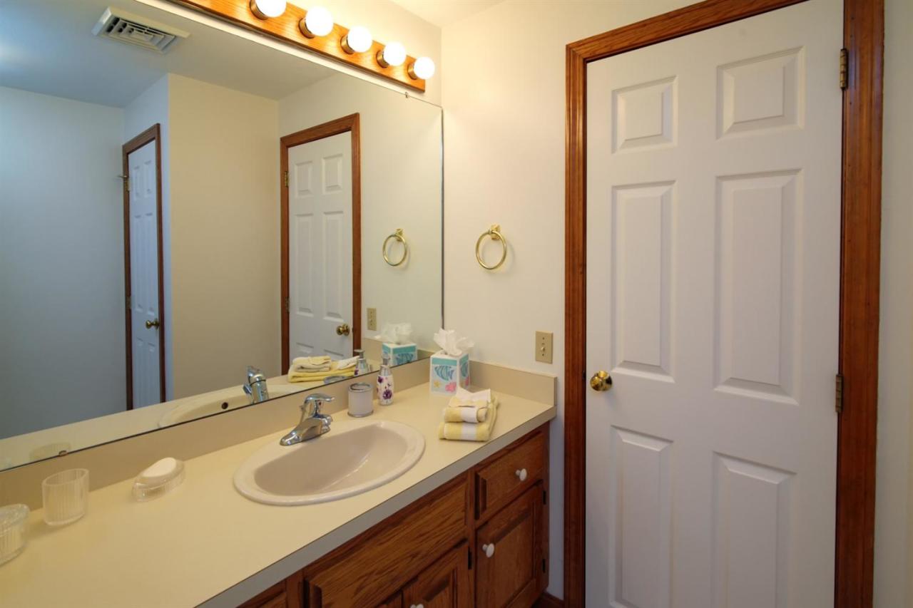43 Piney Road Cotuit, MA 02635 - Photo 23 of 31 a bathroom with a sink and a mirror
