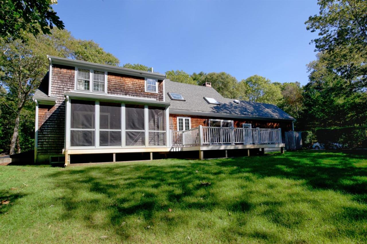 43 Piney Road Cotuit, MA 02635 - Photo 26 of 31 a view of a house with a yard and sitting area