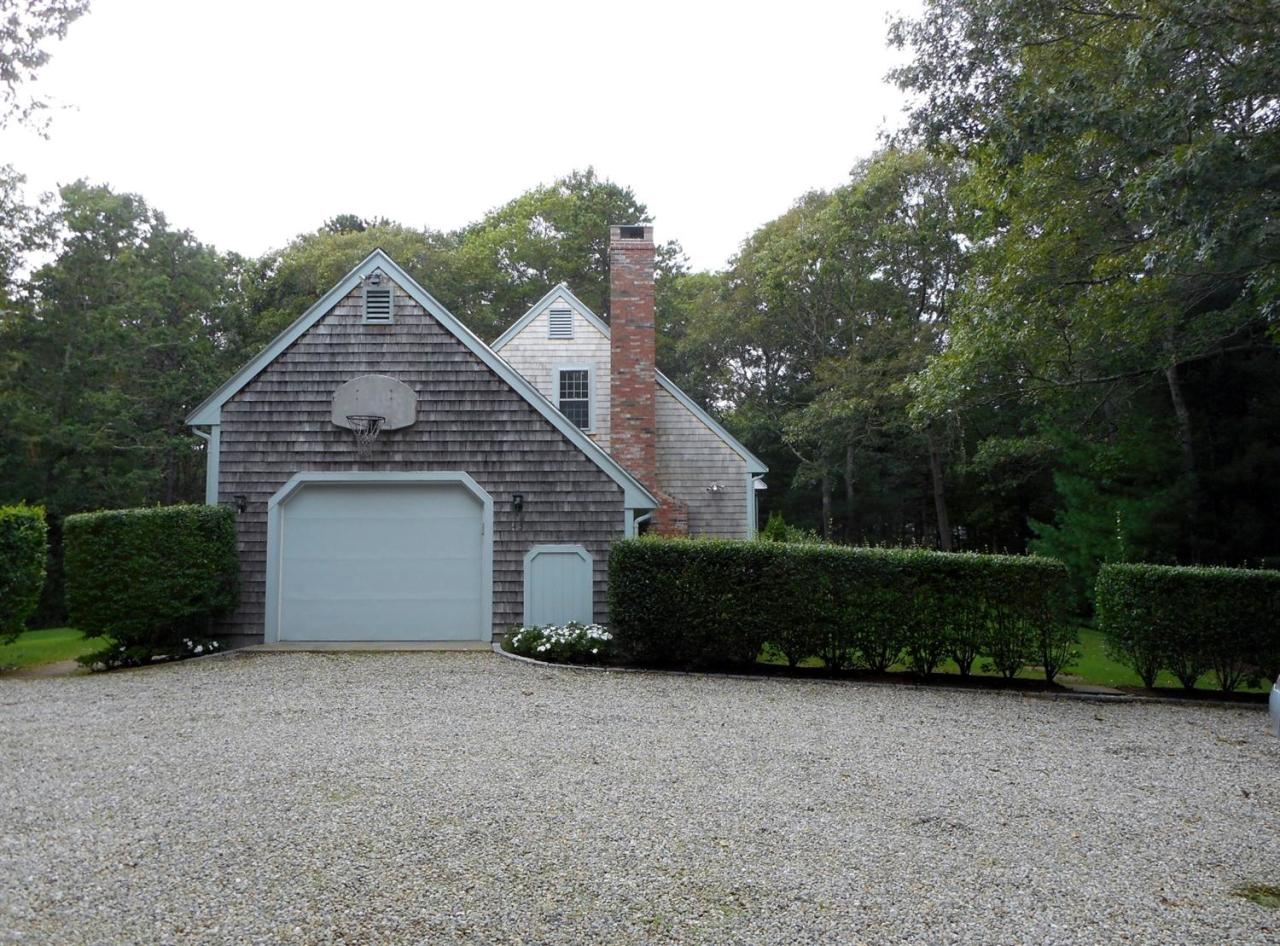 43 Piney Road Cotuit, MA 02635 - Photo 28 of 31 a view of a house with a yard