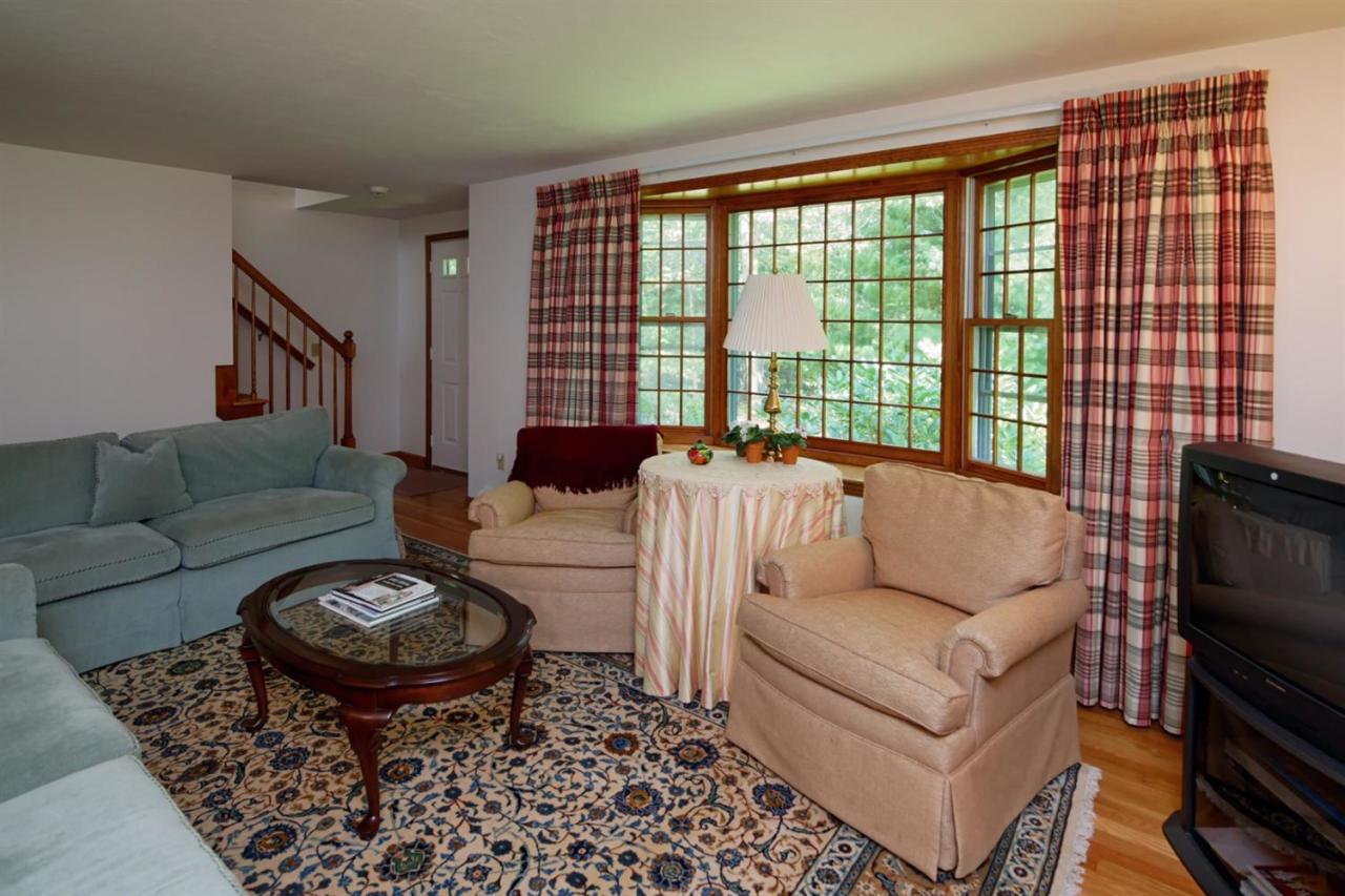43 Piney Road Cotuit, MA 02635 - Photo 5 of 31 a living room with furniture and a large window
