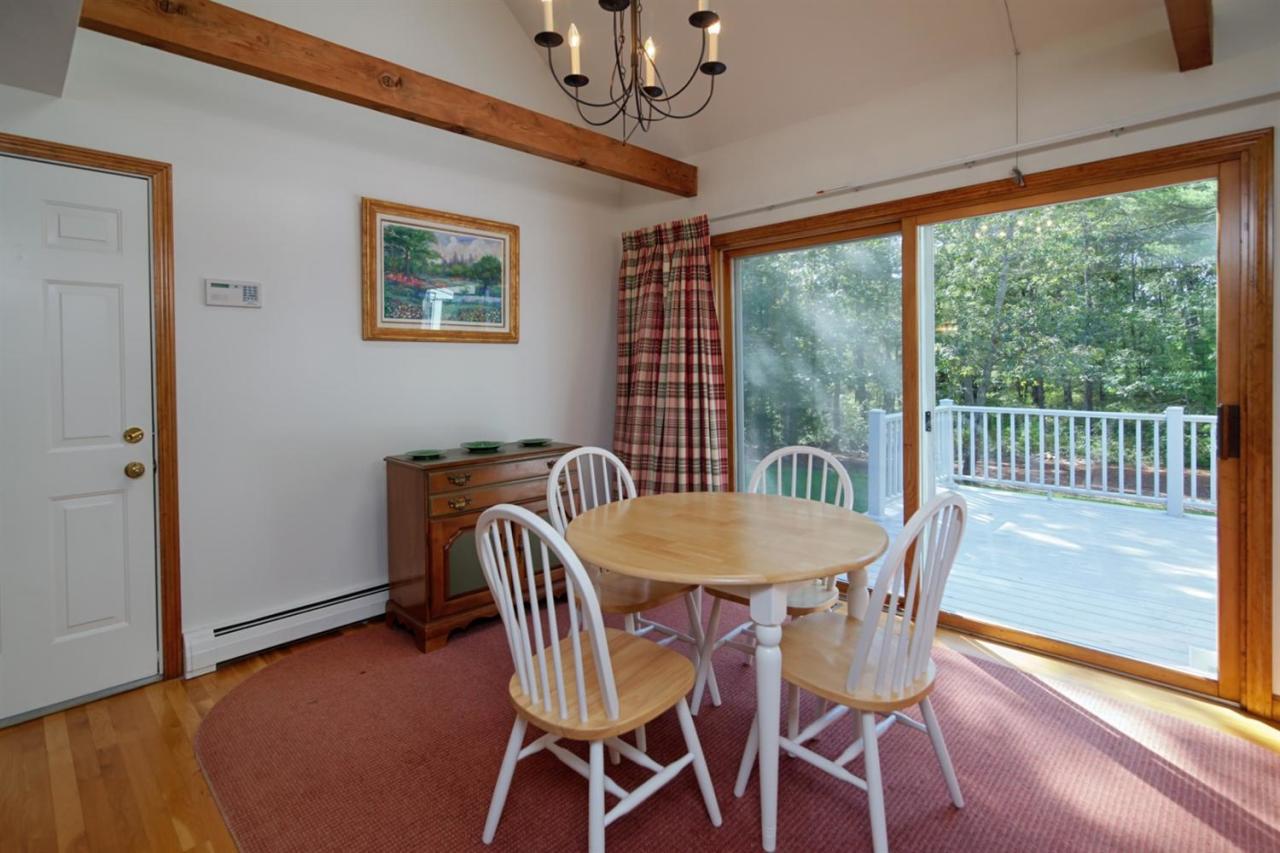 43 Piney Road Cotuit, MA 02635 - Photo 10 of 31 a view of a dining room with furniture window and wooden floor