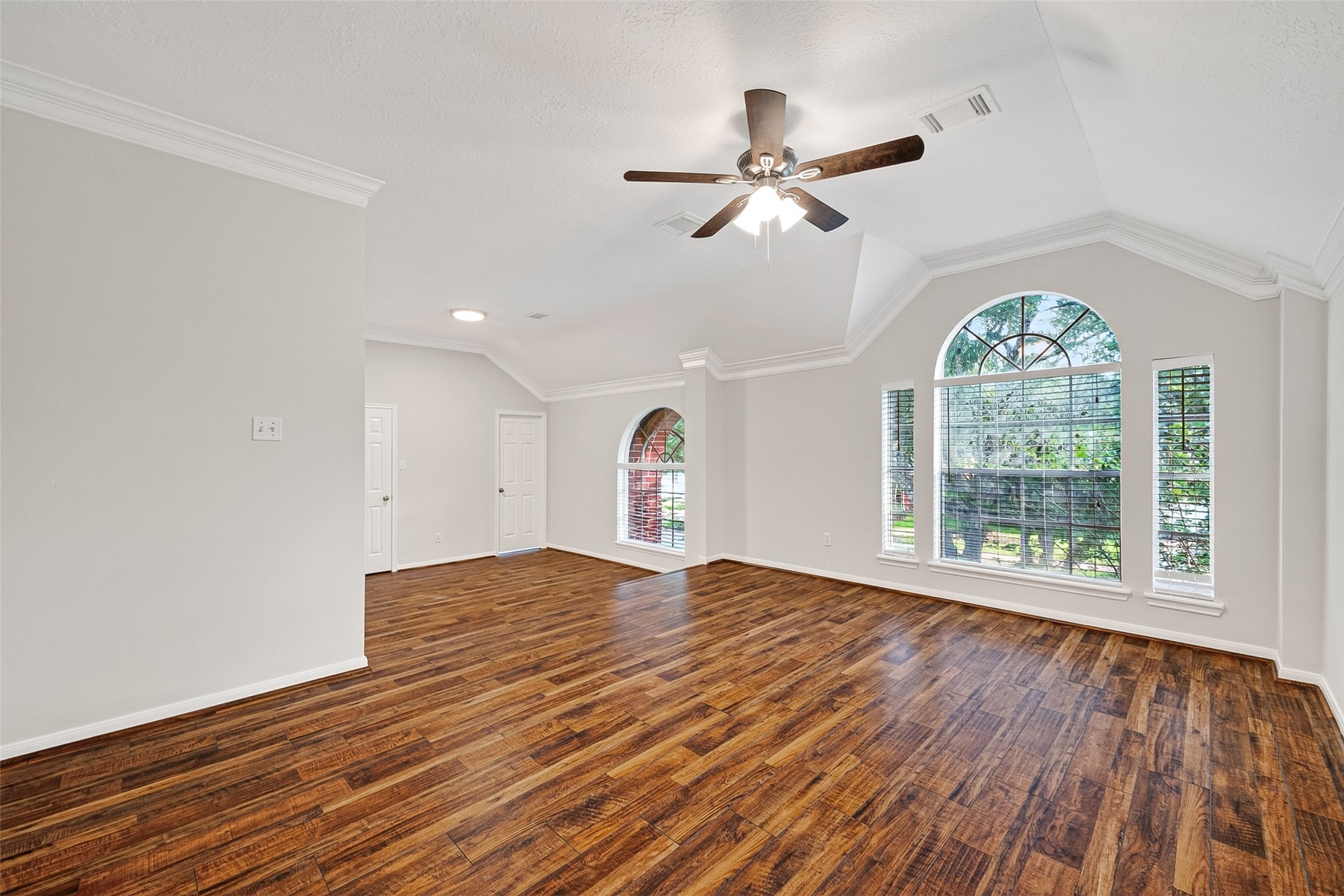 4539 Springfield Lakes Street Sugar Land, TX 77479 - Photo 30 of 34 a view of an empty room with wooden floor and a window
